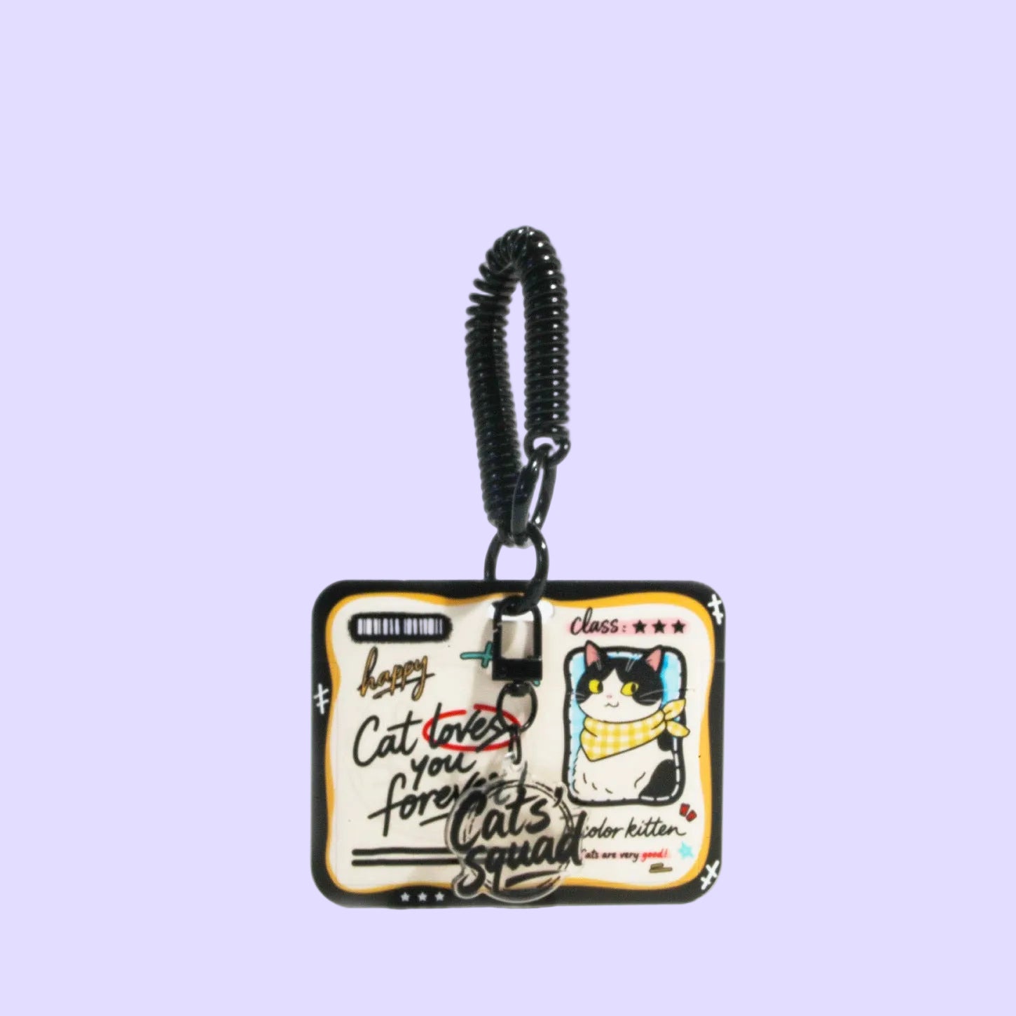 A square keychain or bag charm with a black coiled strap and clasp, featuring a cartoon cat wearing a yellow scarf and handwritten text on a cream background.
