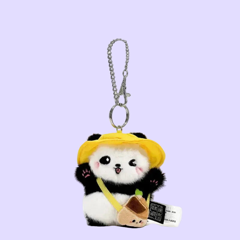 A plush panda keychain charm wearing a yellow hat and holding a small bamboo shoot, attached to a silver chain.