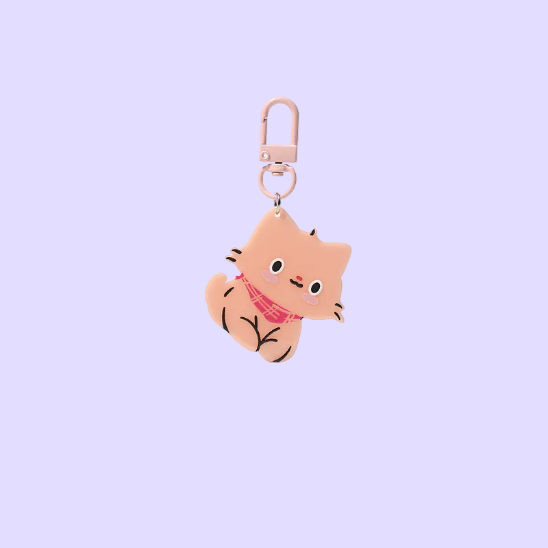 A cute, pastel-colored cat-shaped keychain charm with a pink plaid scarf, attached to a light pink metal carabiner
